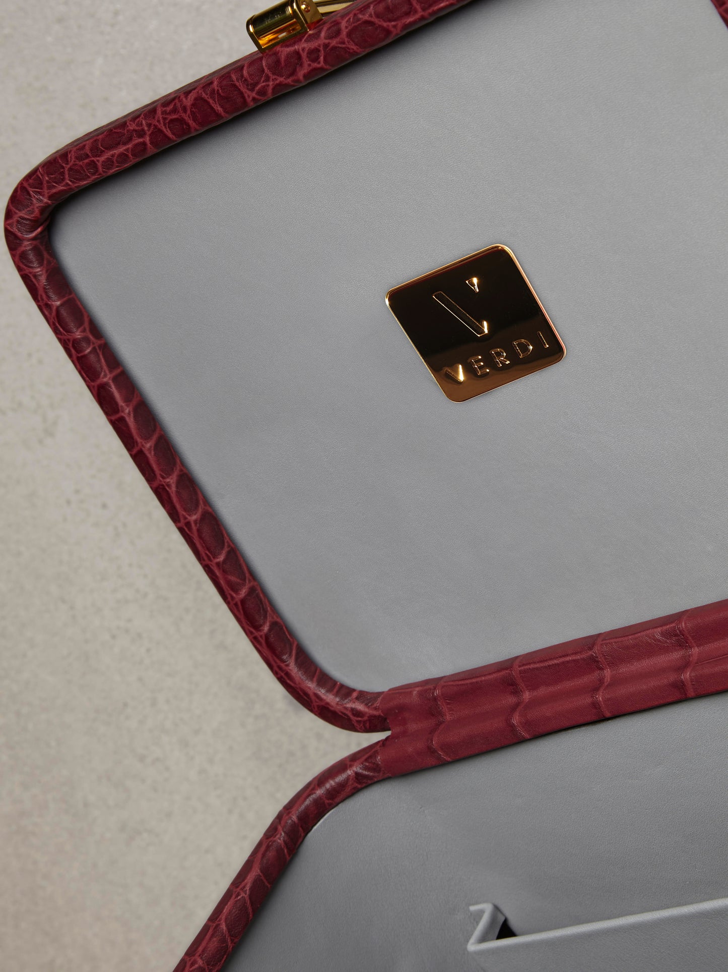 Atelier Verdi medium wine crocodile print leather vanity case, lid detail